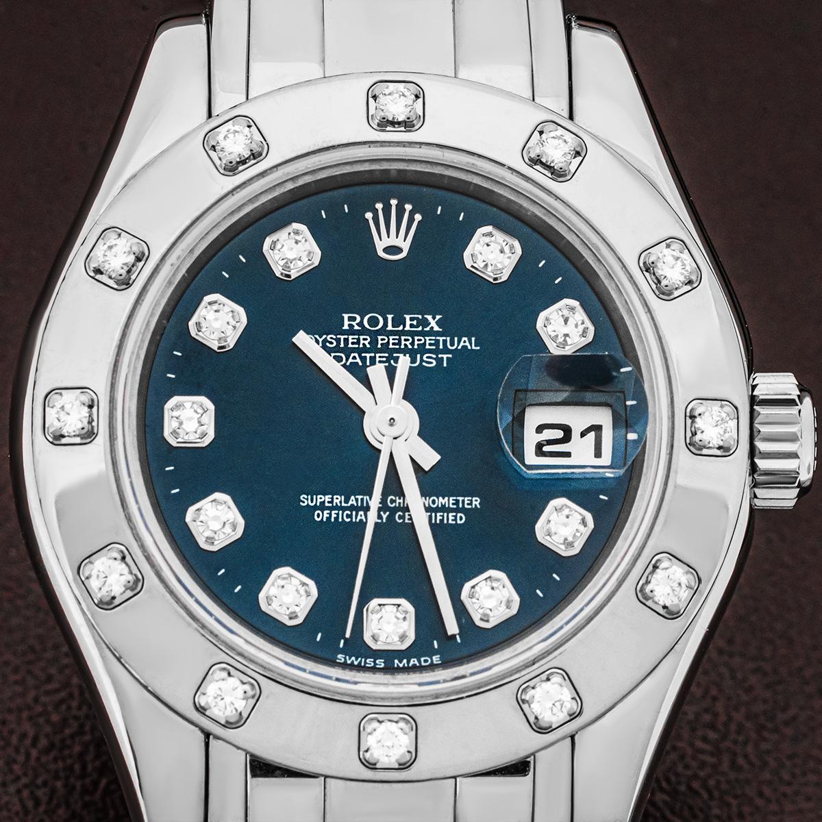 A white gold ladies Datejust pearlmaster by Rolex. Featuring a blue diamond dial with a white gold bezel set with 12 round brilliant cut diamonds. The watch is also fitted with a sapphire crystal, a self-winding automatic movement and a white gold