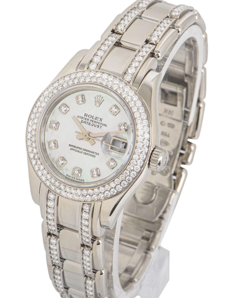 A white gold 29mm Datejust Pearlmaster by Rolex. Features a white mother of pearl dial set with 10 round brilliant cut diamond hour markers and the bezel set with 116 round brilliant cut diamonds.

The Pearlmaster bracelet equipped with a concealed