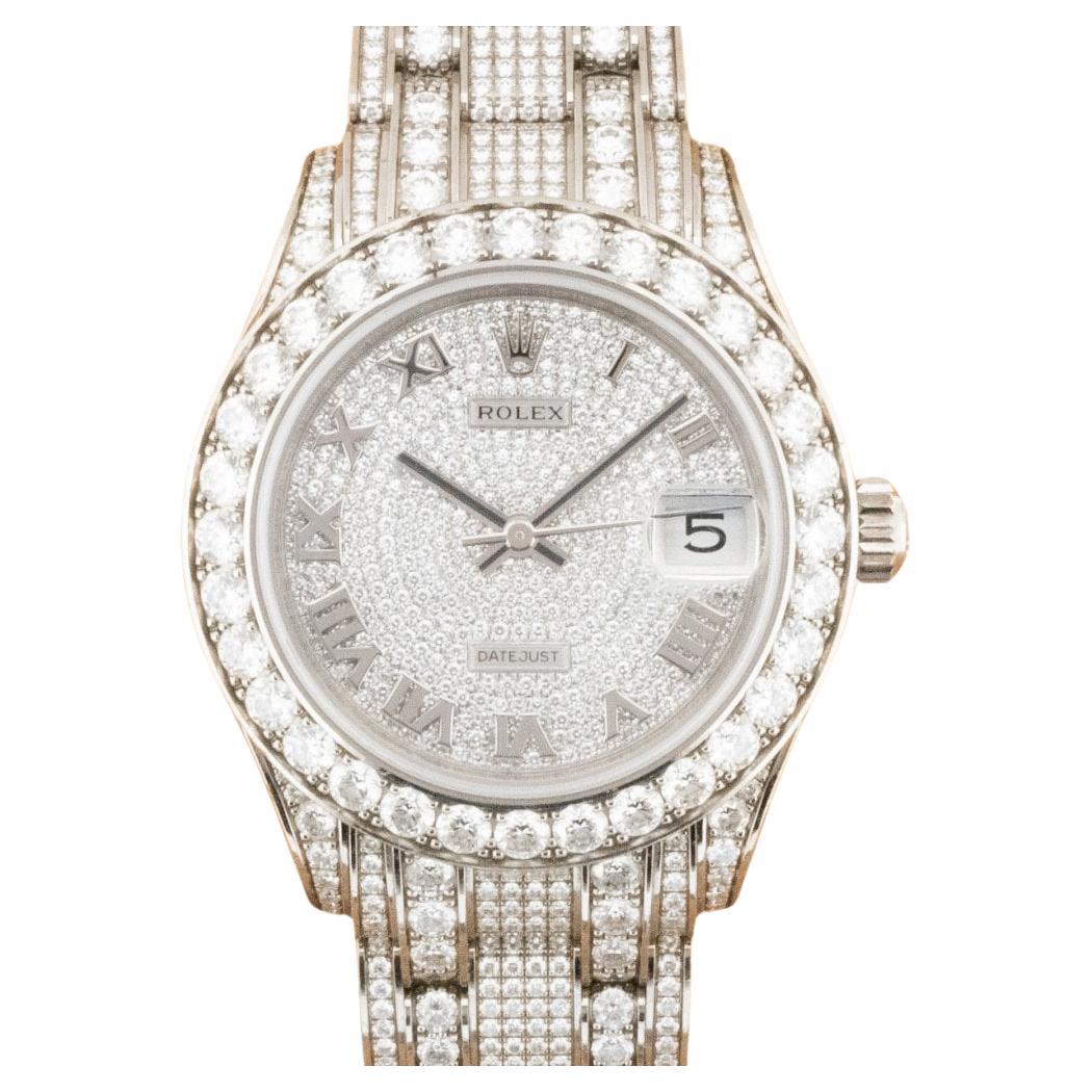 This watch is in stock now and available for collection or delivery.

Case Size: 34mm
Movement: Automatic
Case Material: 18ct White Gold & Diamonds
Bracelet Material: 18ct White Gold & Diamonds
Fastening: Deployment

Includes:

Inner and Outer