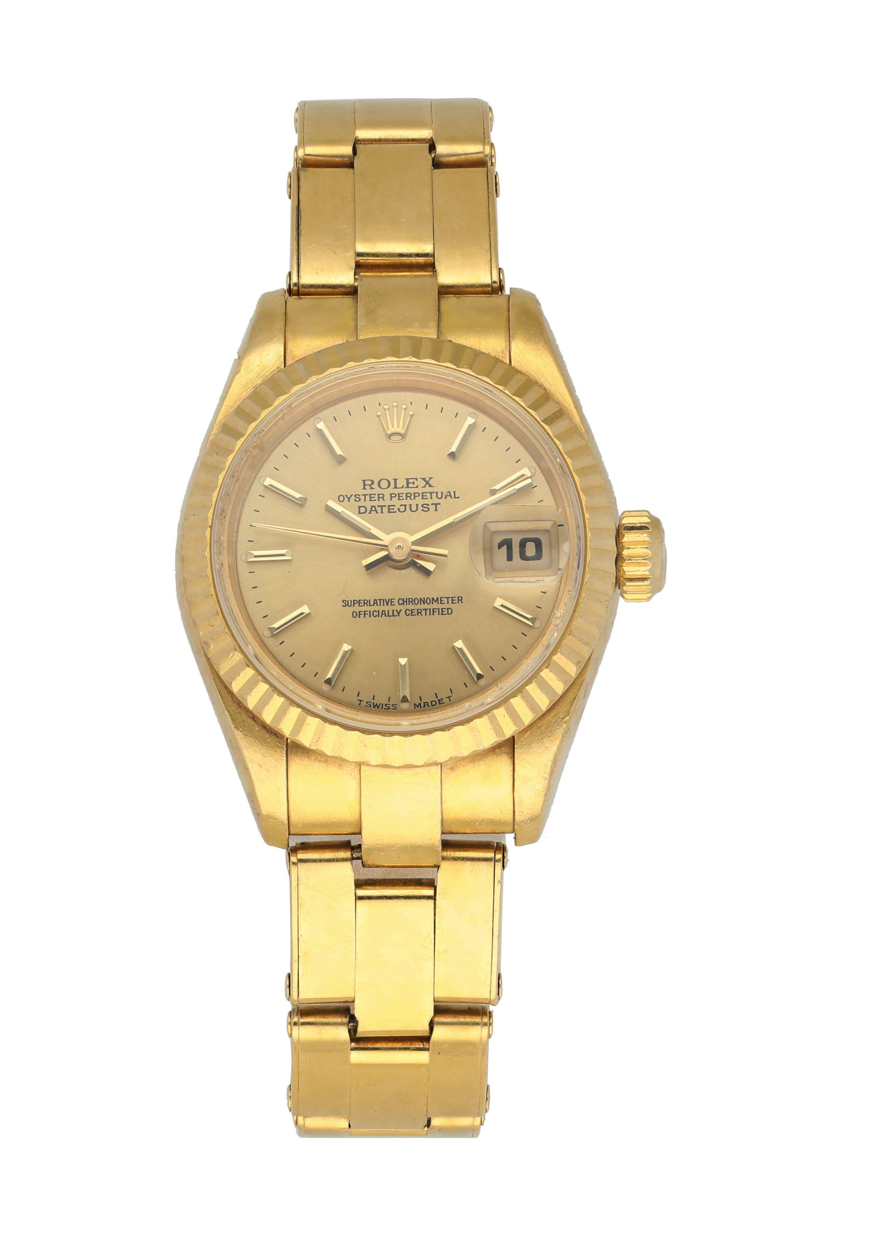 Rolex Datejust President 69178 Ladies Watch. 
26mm 18k Yellow gold case. 
Yellow Gold fluted bezel. 
Champagne dial with gold hands and index hour markers. 
Minute markers on the outer dial. 
Date display at the 3 o'clock position. 
Yellow Gold