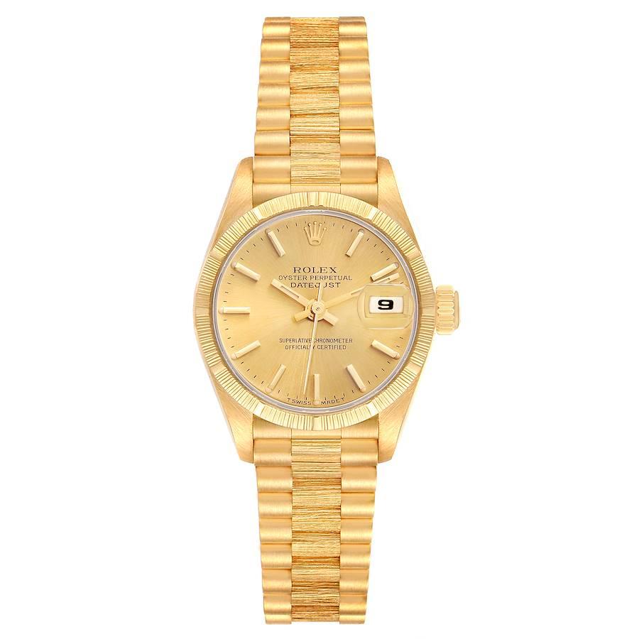 Rolex Datejust President Yellow Gold Bark Finish Ladies Watch 69278. Officially certified chronometer automatic self-winding movement. 18k yellow gold oyster case 26.0 mm in diameter. Rolex logo on the crown. 18k yellow gold engine turned bezel with