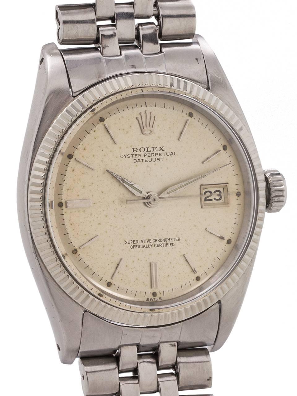 Very pleasing example early vintage Rolex stainless steel Datejust ref# 1601 serial # 657,xxx circa 1961. Featuring a 36mm diameter Oyster case with finely milled 14K WG bezel, acrylic crystal, and original, lightly spotted, silvered satin dial with