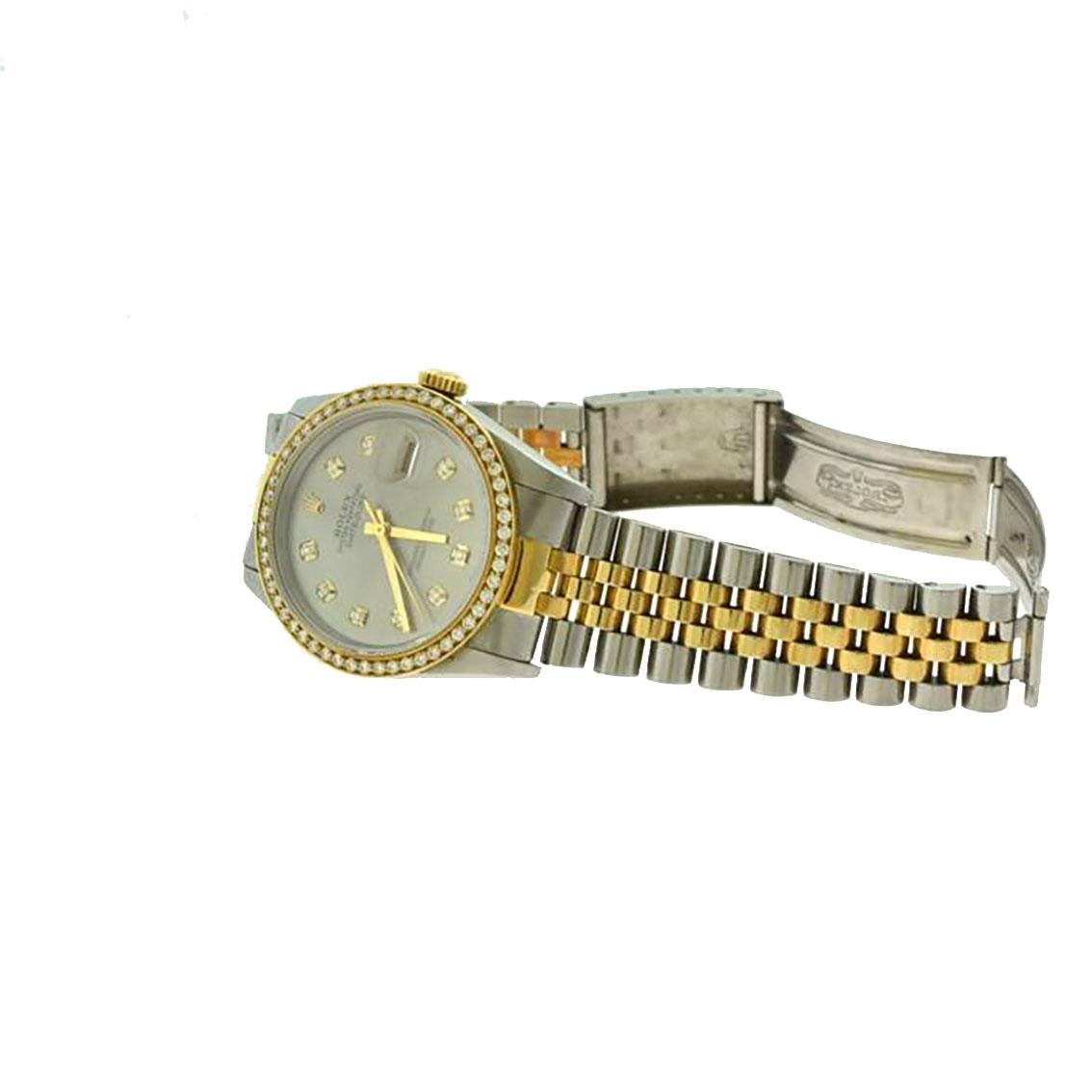 Brand: Rolex

Model Name: Datejust

Model Number: 16013

Movement: Automatic

Case Size: 36 mm

Case Material: Stainless Steel / 18k Yellow Gold

Dial: Silver Dial/Diamond Hour Markers

Bezel: Custom Diamond

Hour Markers: Diamond

Bracelet: