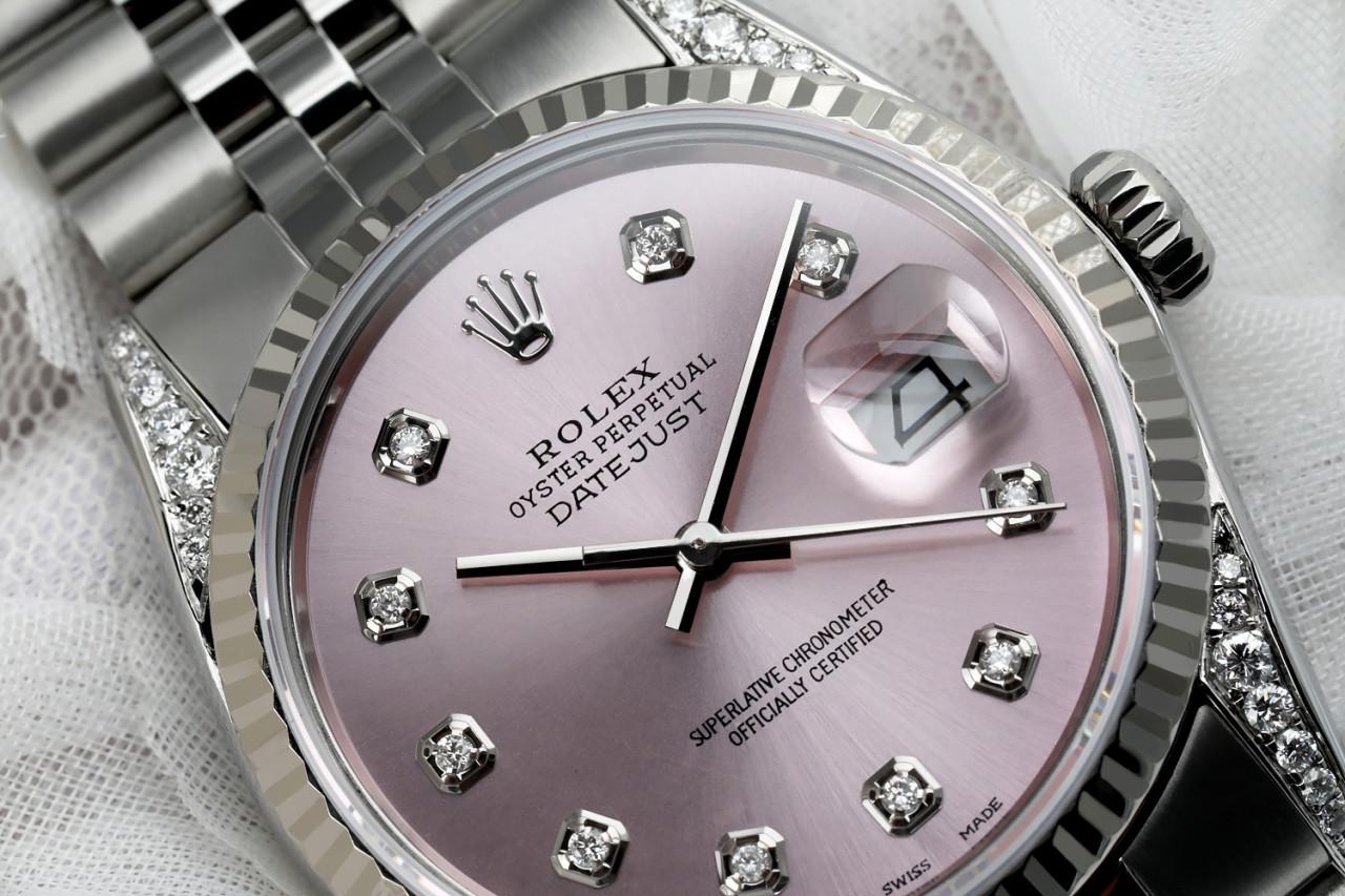 Rolex Datejust SS Metallic Pink Diamond Dial Custom Diamond Lugs 16014.
This watch is in like new condition. It has been polished, serviced and has no visible scratches or blemishes. All our watches come with a standard 1 year mechanical warranty