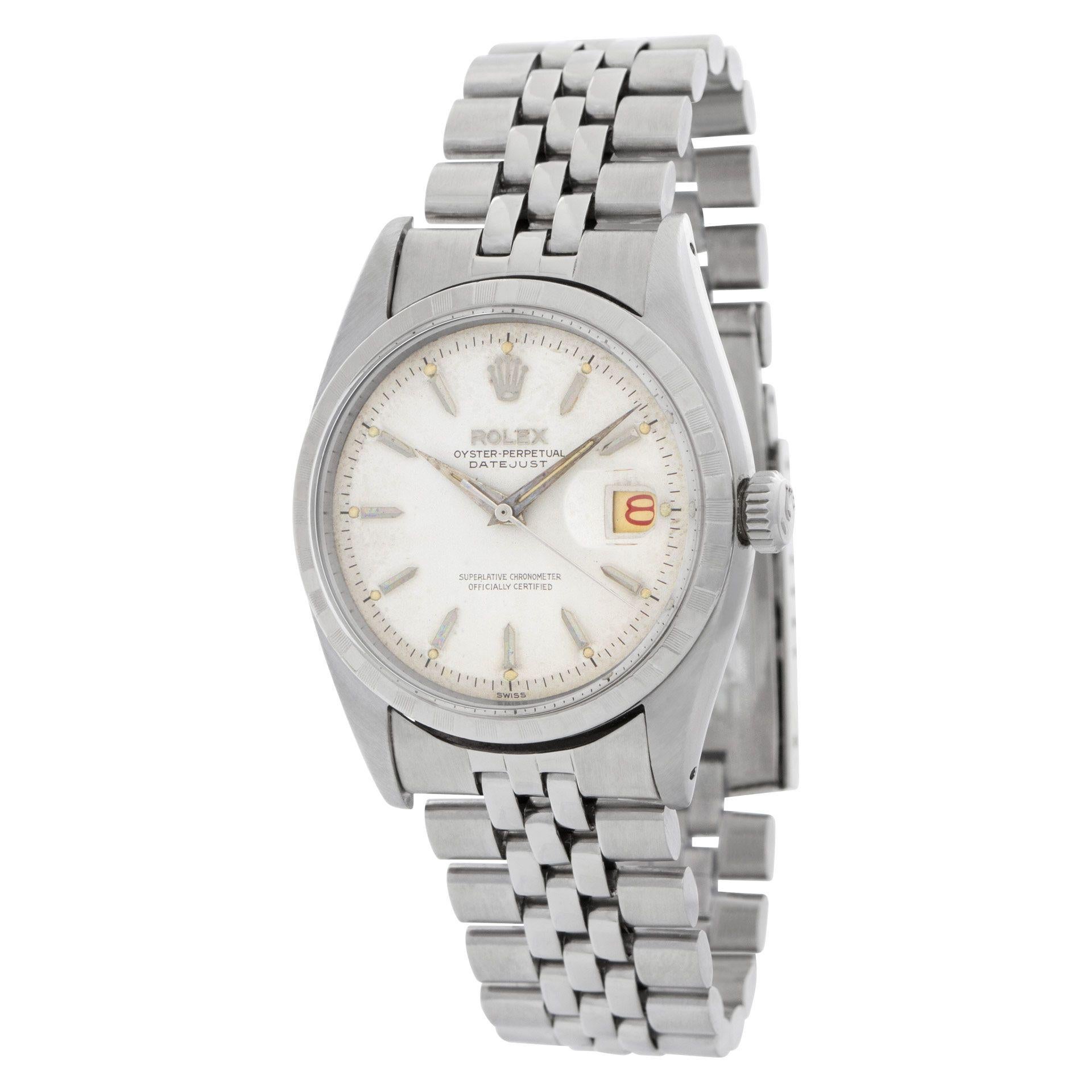 Vintage rare 1958 Rolex Datejust, model number 6605. The watch dial is in good condition, featuring a slight patina that adds to its unique character. It retains the original hands and lume, which are both in exceptional condition for their age.