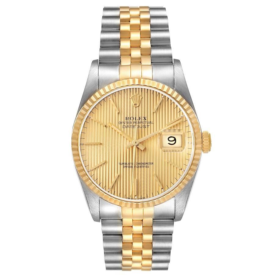 Rolex Datejust Steel 18K Yellow Gold Champagne Tapestry Dial Watch 16233. Officially certified chronometer self-winding movement. Stainless steel case 36 mm in diameter.  Rolex logo on a 18K yellow gold crown. 18k yellow gold fluted bezel. Scratch