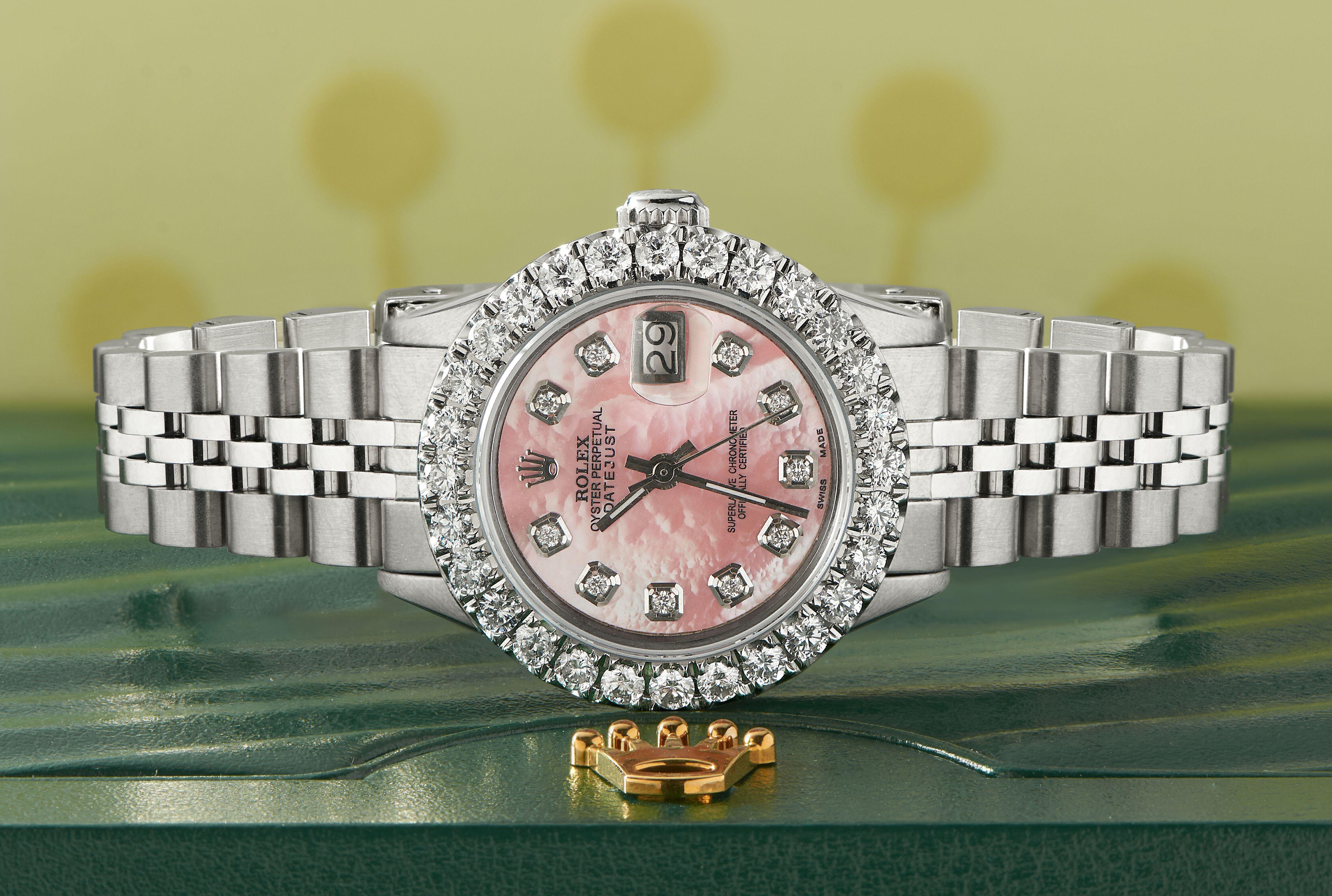 Rolex Datejust Steel Ladies Watch. Self-winding Rolex automatic movement. Stainless steel case 26mm in diameter. Custom 2.0ct diamond bezel. Screw-down crown. Scratch-resistant sapphire crystal. Custom vibrant pink diamond dial. Factory stainless