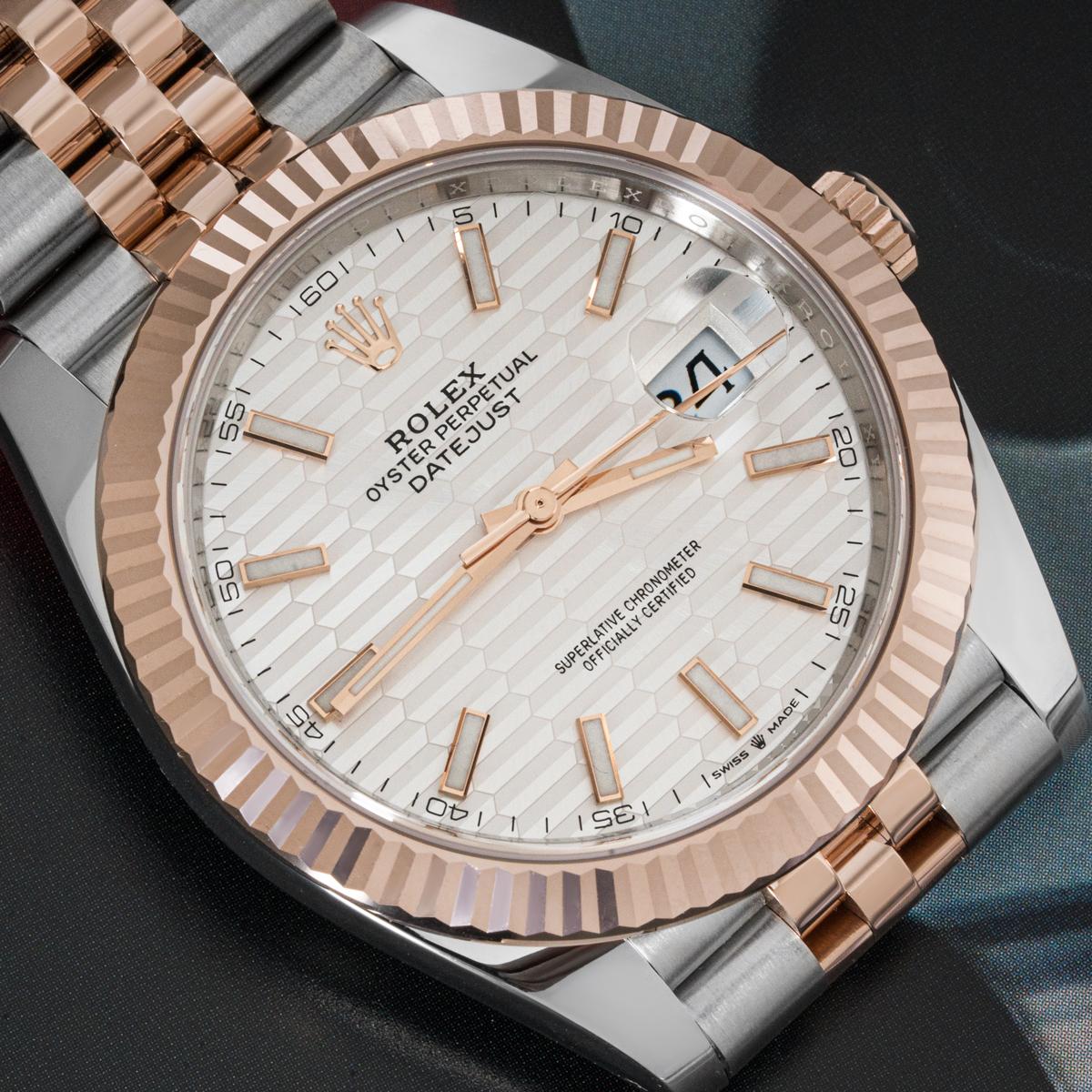 A 41mm Datejust in stainless steel and rose gold by Rolex. Featuring a distinctive silver fluted motif dial with applied hour markers and a fluted rose gold bezel.

The Jubilee bracelet is bound together by a folding Oysterclasp equipped with the