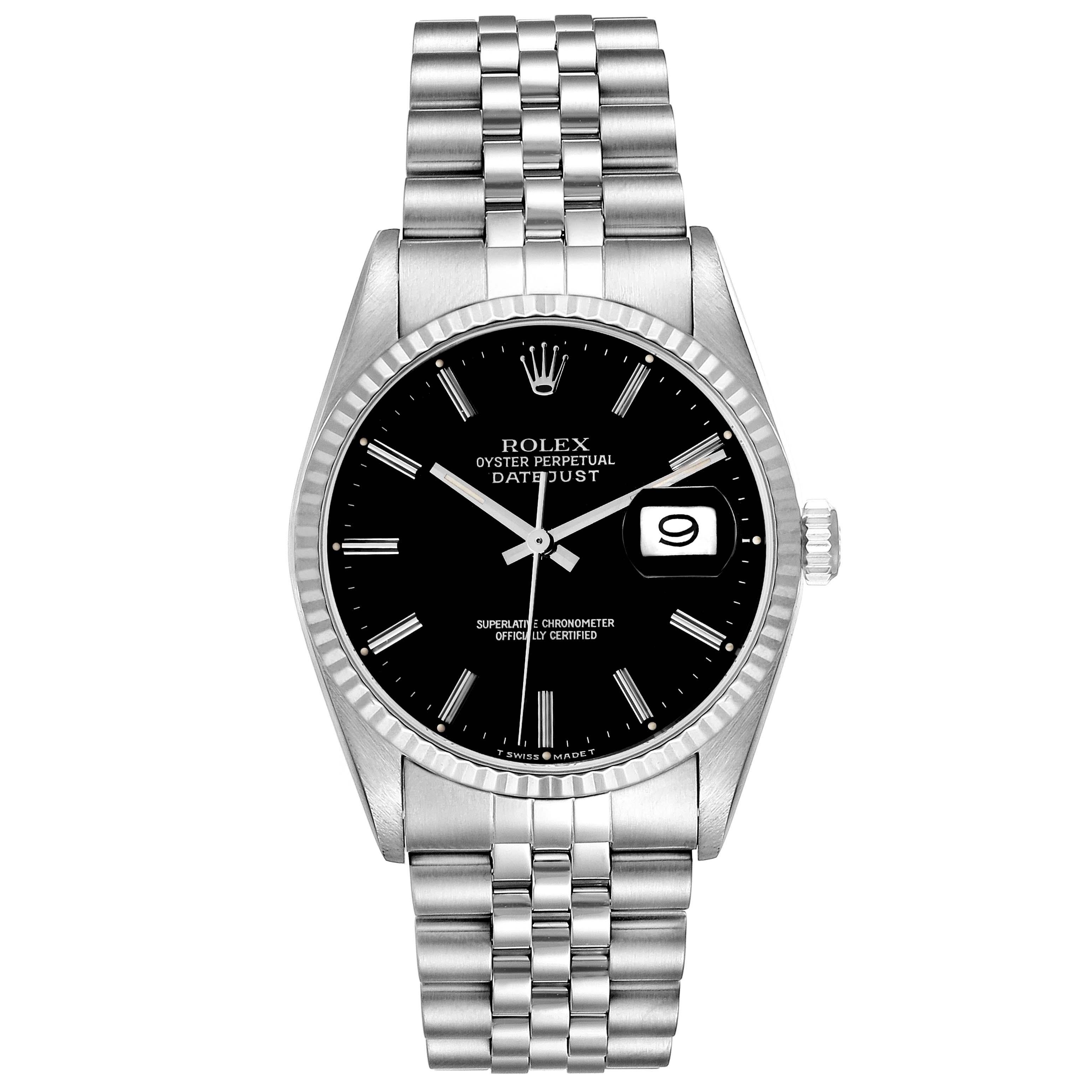 Rolex Datejust Steel White Gold Black Dial Mens Watch 16234 Box Papers. Officially certified chronometer automatic self-winding movement. Stainless steel oyster case 36 mm in diameter. Rolex logo on the crown. 18k white gold fluted bezel. Scratch