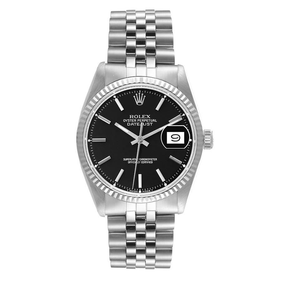 Rolex Datejust Steel White Gold Black Dial Vintage Mens Watch 1601. Officially certified chronometer automatic self-winding movement. Stainless steel oyster case 36 mm in diameter. Rolex logo on the crown. 18k white gold fluted bezel. Acrylic