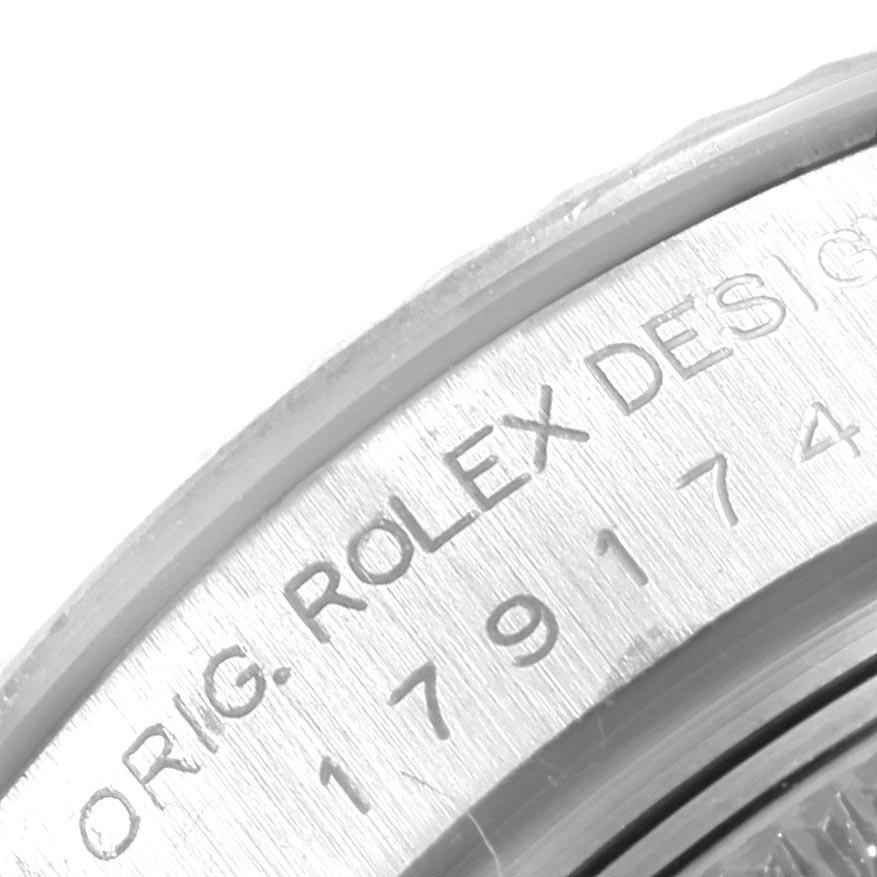 Rolex Datejust Steel White Gold Black Roman Dial Ladies Watch 179174. Officially certified chronometer automatic self-winding movement. Stainless steel oyster case 26.0 mm in diameter. Rolex logo on a crown. 18K white gold fluted bezel. Scratch