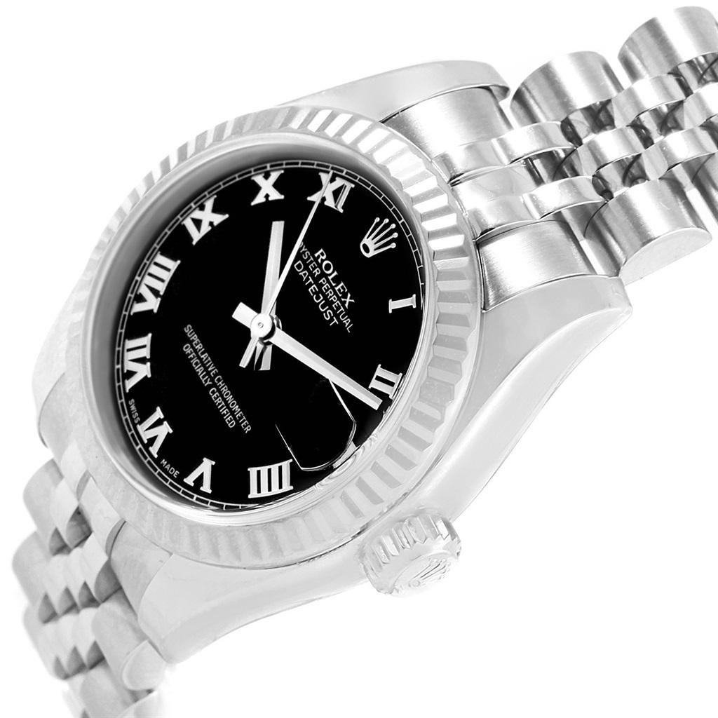 Rolex Datejust Steel White Gold Black Roman Dial Ladies Watch 179174. Officially certified chronometer automatic self-winding movement. Stainless steel oyster case 26.0 mm in diameter. Rolex logo on a crown. 18K white gold fluted bezel. Scratch