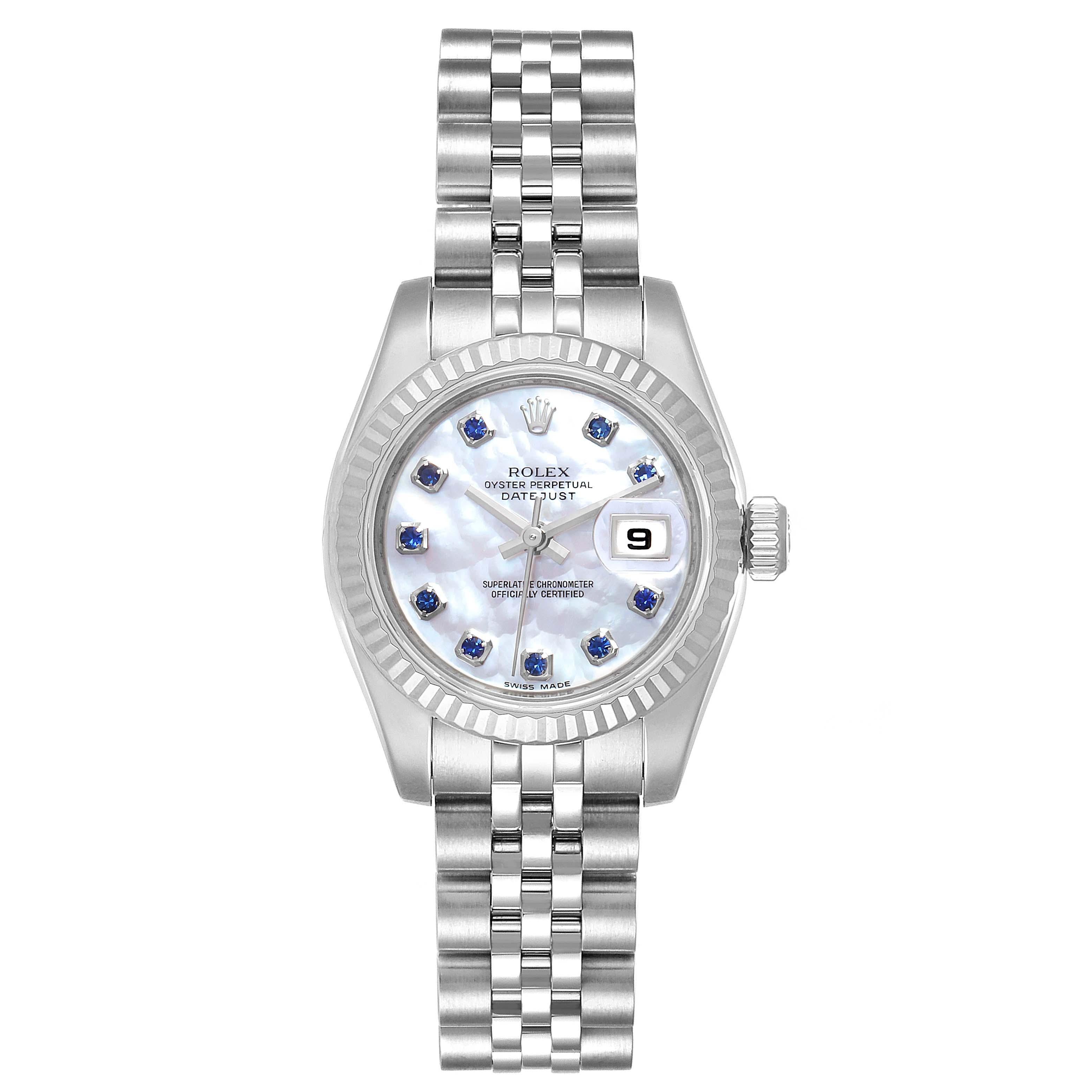 Rolex Datejust Steel White Gold MOP Saphire Ladies Watch 179174 Box Card. Officially certified chronometer self-winding movement. Stainless steel oyster case 26.0 mm in diameter. Rolex logo on a crown. 18K white gold fluted bezel. Scratch resistant
