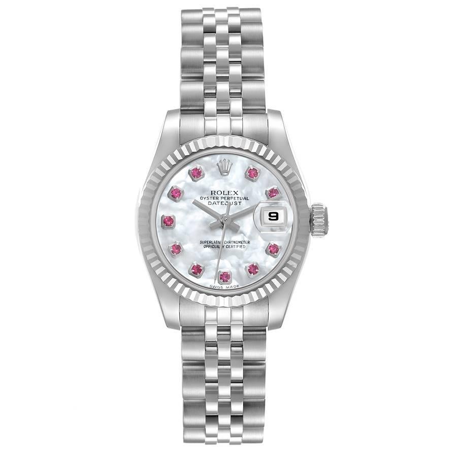 Rolex Datejust Steel White Gold Mother of Pearl Ruby Dial Ladies Watch 179174. Officially certified chronometer self-winding movement. Stainless steel oyster case 26.0 mm in diameter. Rolex logo on the crown. 18K white gold fluted bezel. Scratch