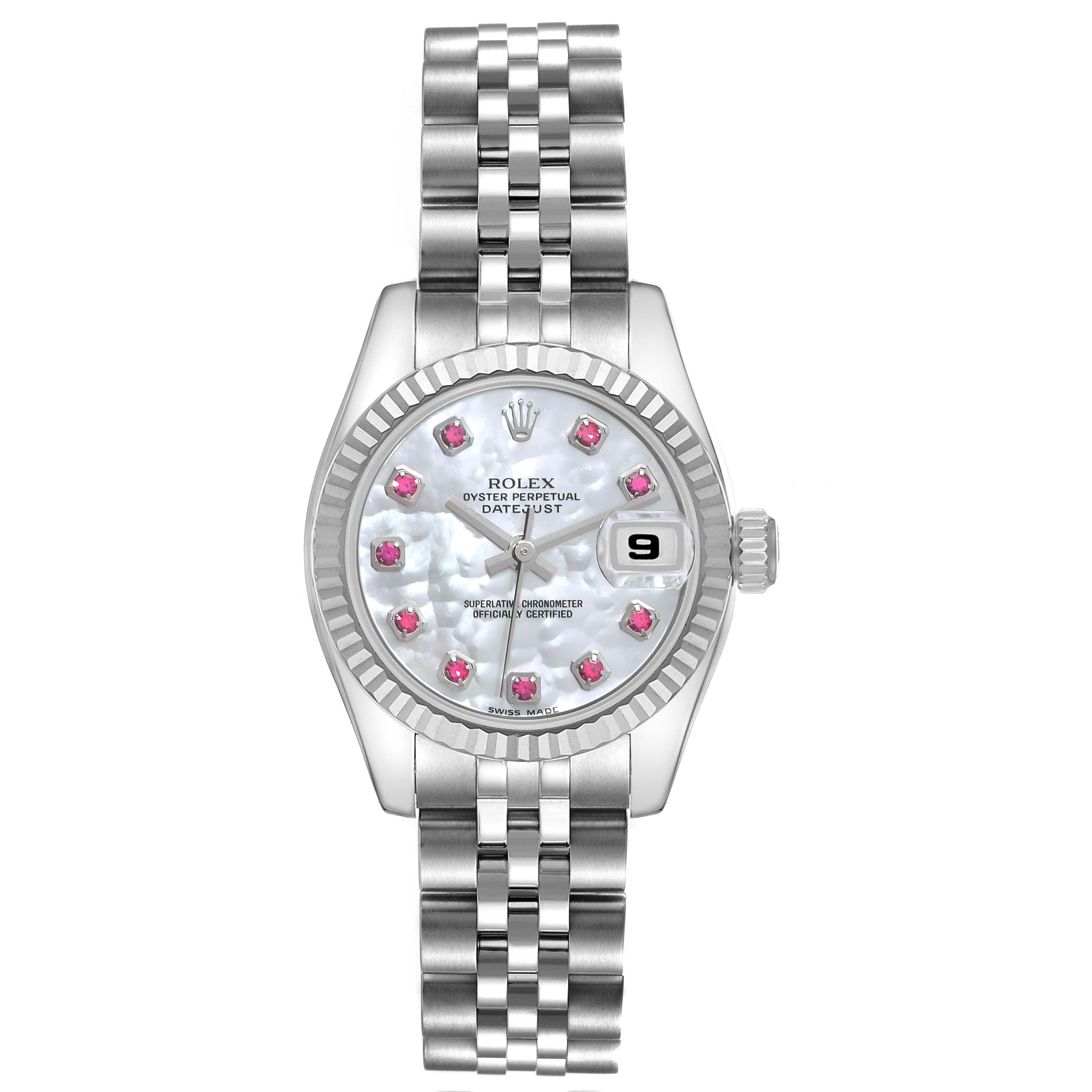 Rolex Datejust Steel White Gold Mother of Pearl Ruby Dial Ladies Watch 179174. Officially certified chronometer self-winding movement. Stainless steel oyster case 26.0 mm in diameter. Rolex logo on the crown. 18K white gold fluted bezel. Scratch