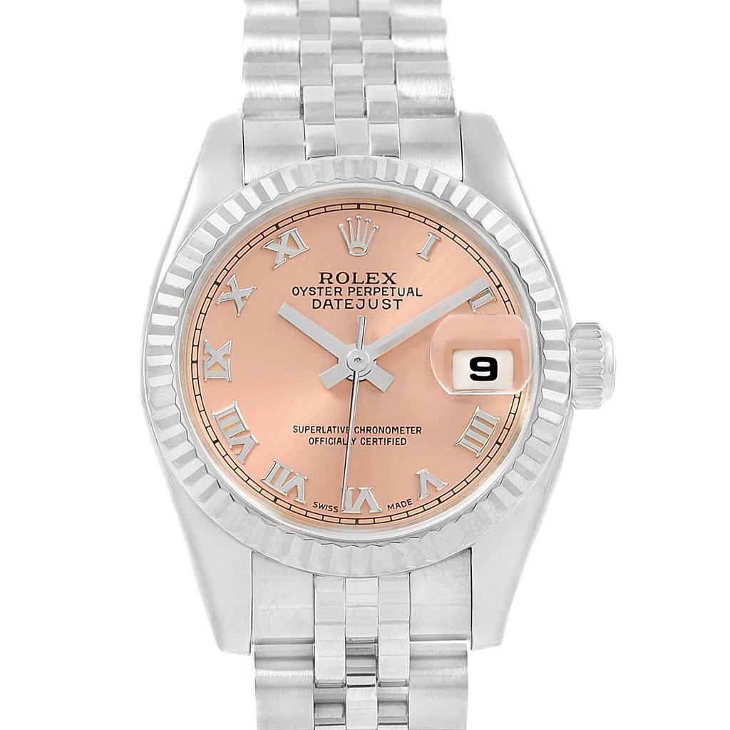 Rolex Datejust Steel White Gold Salmon Roman Dial Ladies Watch 179174. Officially certified chronometer automatic self-winding movement. Stainless steel oyster case 26.0 mm in diameter. Rolex logo on a crown. 18K white gold fluted bezel. Scratch