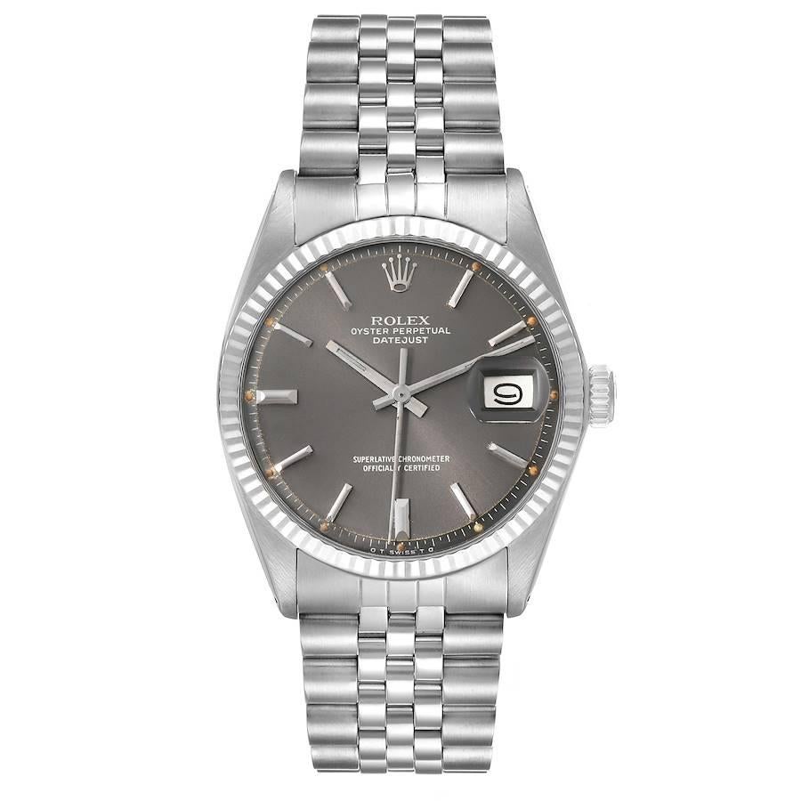 Rolex Datejust Steel White Gold Sigma Grey Ghost Dial Vintage Mens Watch 1601. Officially certified chronometer automatic self-winding movement. Stainless steel oyster case 36 mm in diameter. Rolex logo on the crown. 18k white gold fluted bezel.