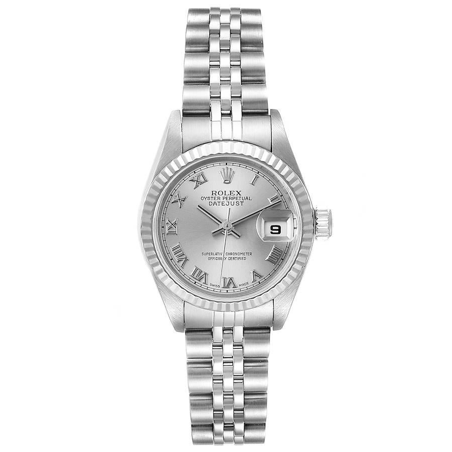Rolex Datejust Steel White Gold Silver Dial Ladies Watch 79174. Officially certified chronometer self-winding movement. Stainless steel oyster case 26.0 mm in diameter. Rolex logo on a crown. 18k white gold fluted bezel. Scratch resistant sapphire