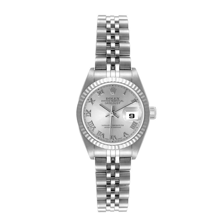 Rolex Datejust Steel White Gold Silver Dial Ladies Watch 79174. Officially certified chronometer self-winding movement. Stainless steel oyster case 26.0 mm in diameter. Rolex logo on a crown. 18K white gold fluted bezel. Scratch resistant sapphire