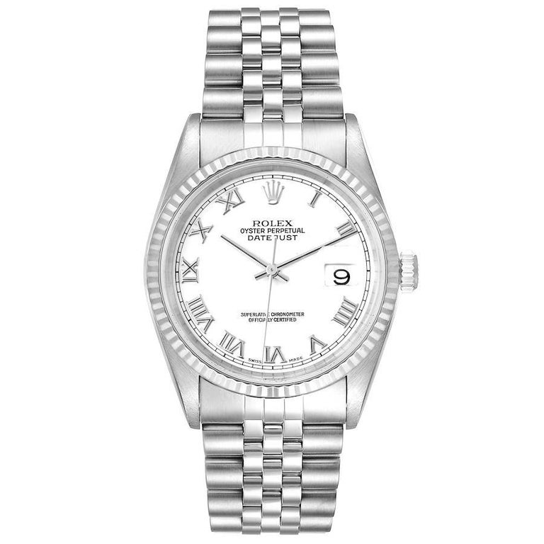 Rolex Datejust Steel White Gold White Dial Jubilee Bracelet Watch 16234. Officially certified chronometer self-winding movement. Stainless steel case 36.0 mm in diameter. Rolex logo on a crown. 18K white gold fluted bezel. Scratch resistant sapphire