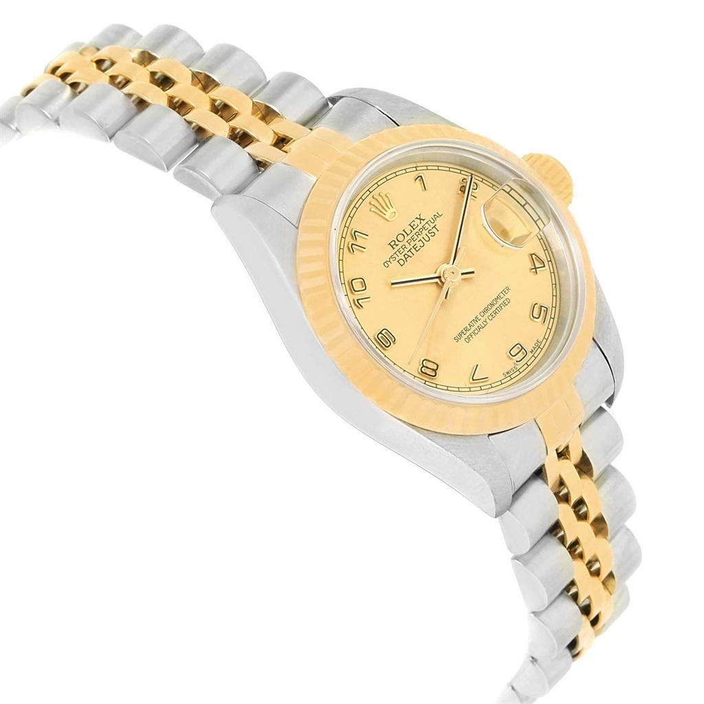 Rolex Datejust Steel Yellow Gold Arabic Dial Ladies Watch 79173. Officially certified chronometer automatic self-winding movement. Stainless steel oyster case 26.0 mm in diameter. Rolex logo on a 18K yellow gold crown. 18k yellow gold fluted bezel.