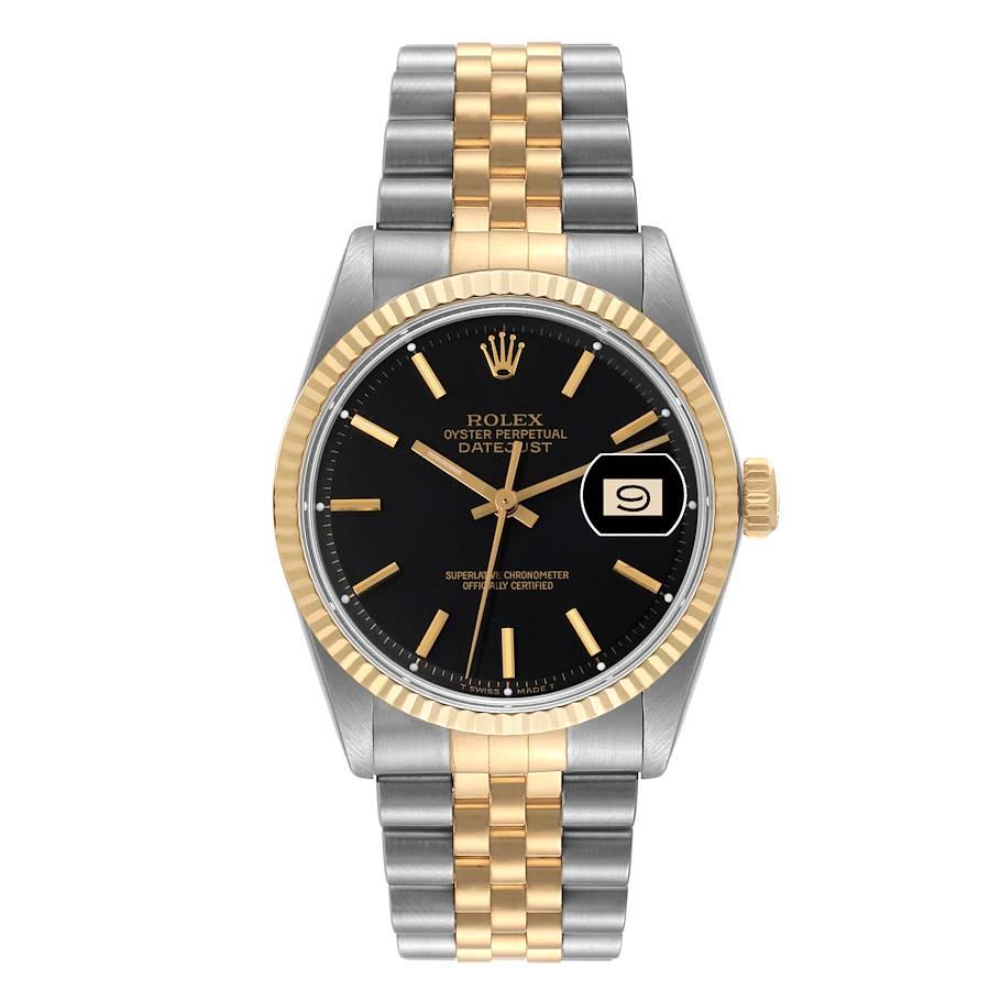 Rolex Datejust Steel Yellow Gold Black Dial Vintage Mens Watch 1601. Officially certified chronometer automatic self-winding movement. Stainless steel case 36 mm in diameter. Rolex logo on an 18k yellow gold crown. 18k yellow gold fluted bezel.