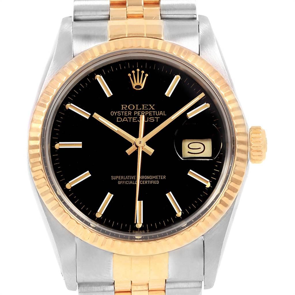 Rolex Datejust Steel Yellow Gold Black Dial Vintage Mens Watch 16013. Officially certified chronometer self-winding movement. Stainless steel oyster case 36.0 mm in diameter. Rolex logo on a crown. 18k yellow gold fluted bezel. Acrylic crystal with