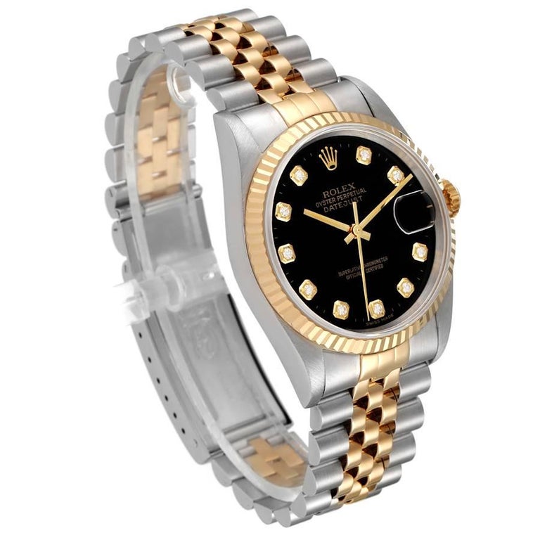 Rolex Datejust Steel Yellow Gold Black Diamond Dial Mens Watch 16233. Officially certified chronometer automatic self-winding movement. Stainless steel case 36.0 mm in diameter. Rolex logo on a crown. 18k yellow gold fluted bezel. Scratch resistant