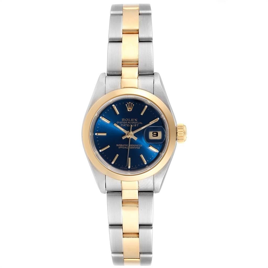 Rolex Datejust Steel Yellow Gold Blue Dial Ladies Watch 69163. Officially certified chronometer self-winding movement. Stainless steel oyster case 26.0 mm in diameter. Rolex logo on a crown. 18k yellow gold smooth bezel. Scratch resistant sapphire