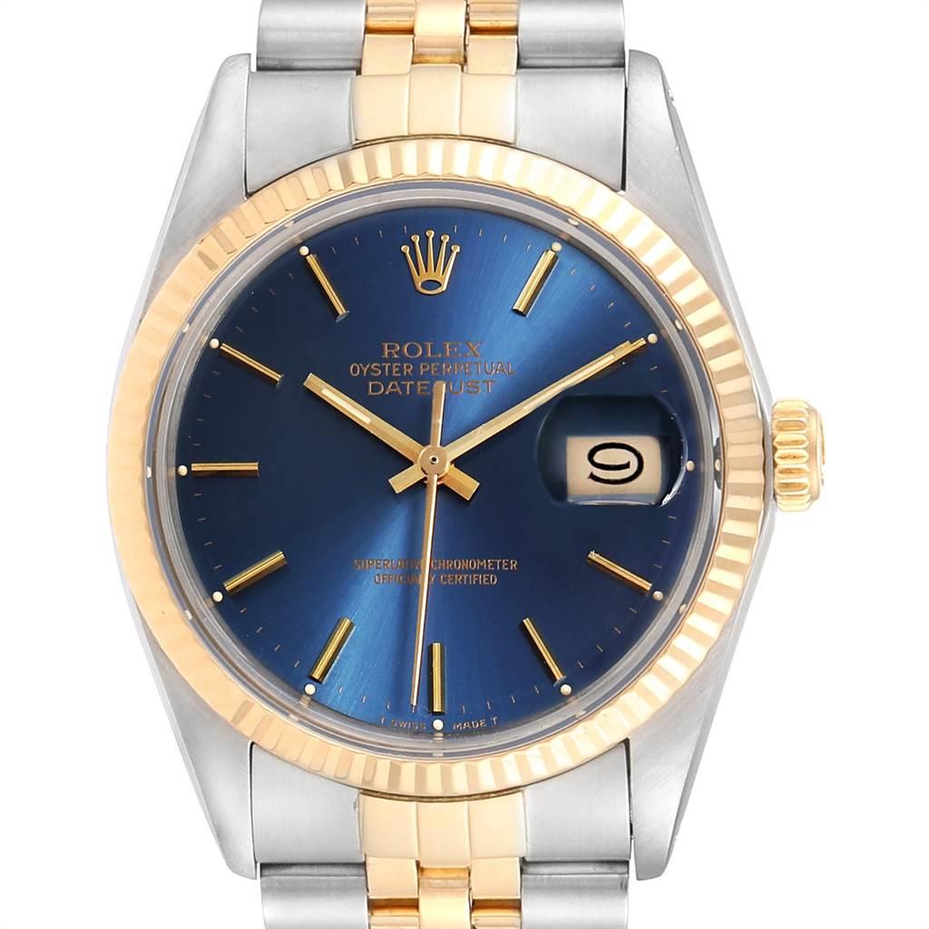 Rolex Datejust Steel Yellow Gold Blue Dial Vintage Mens Watch 16013. Officially certified chronometer self-winding movement. Stainless steel oyster case 36.0 mm in diameter. Rolex logo on a crown. 18k yellow gold fluted bezel. Acrylic crystal with