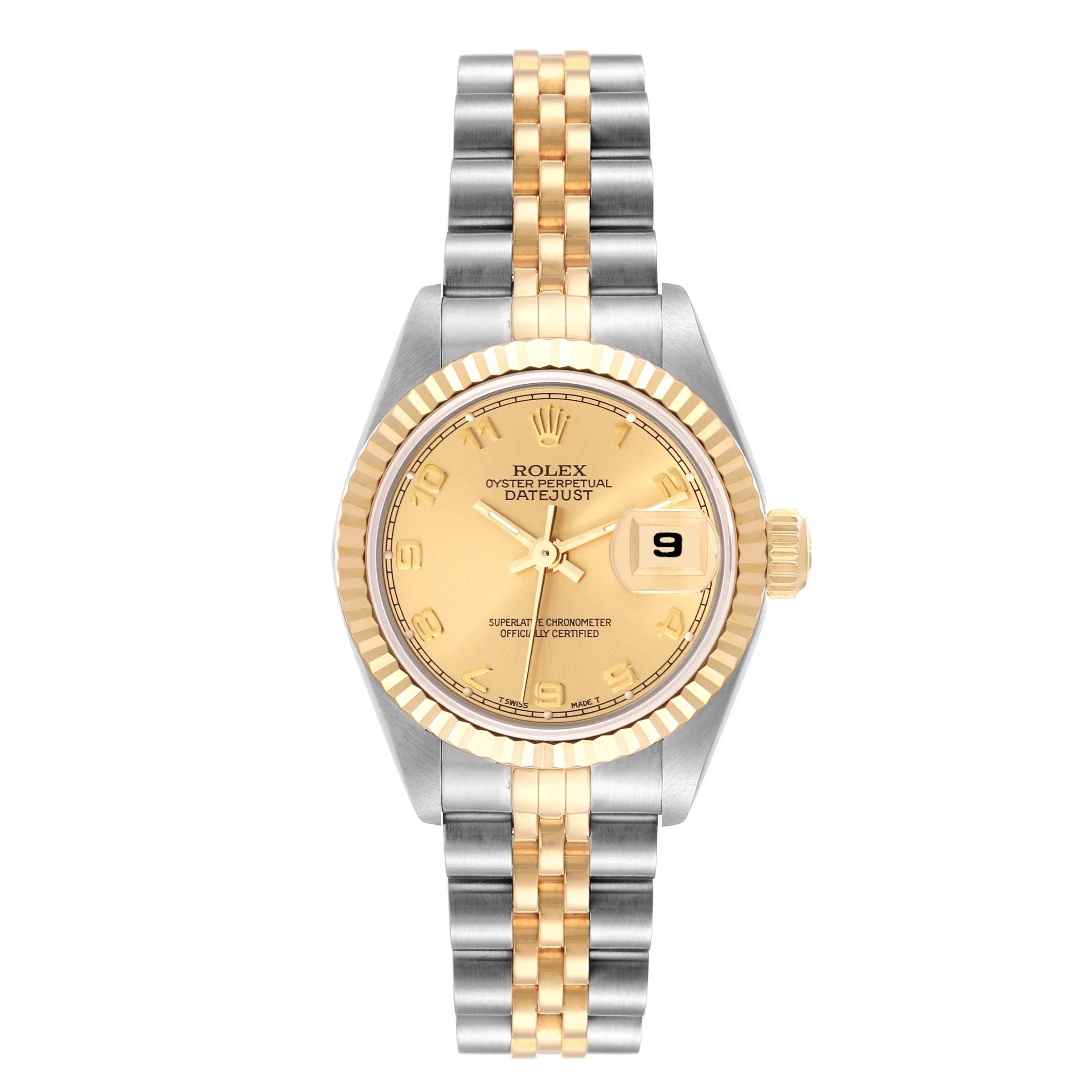 Rolex Datejust Steel Yellow Gold Champagne Arabic Dial Ladies Watch 69173. Officially certified chronometer automatic self-winding movement. Stainless steel oyster case 26.0 mm in diameter. Rolex logo on the crown. 18k yellow gold fluted bezel.