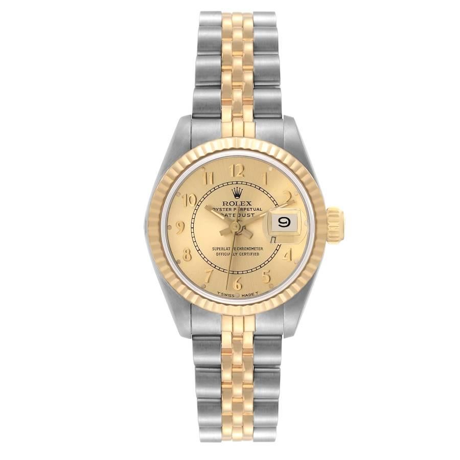 Rolex Datejust Steel Yellow Gold Champagne Bullseye Dial Ladies Watch 69173. Officially certified chronometer automatic self-winding movement. Stainless steel oyster case 26.0 mm in diameter. Rolex logo on the crown. 18k yellow gold fluted bezel.