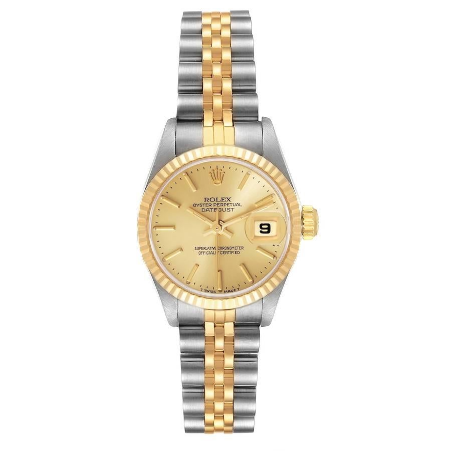 Rolex Datejust Steel Yellow Gold Champagne Dial Ladies Watch 69173. Officially certified chronometer automatic self-winding movement. Stainless steel oyster case 26.0 mm in diameter. Rolex logo on the crown. 18k yellow gold fluted bezel. Scratch