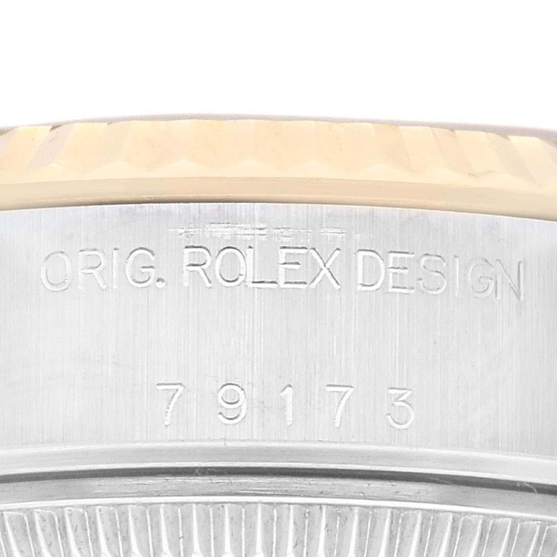 Rolex Datejust Stahl Gelbgold Champagner Zifferblatt Damenuhr 79173. Offiziell zertifiziertes Chronometerwerk mit automatischem Aufzug. Austerngehäuse aus Edelstahl mit einem Durchmesser von 26.0 mm. Rolex Logo auf einer Krone aus 18k Gelbgold. 18k