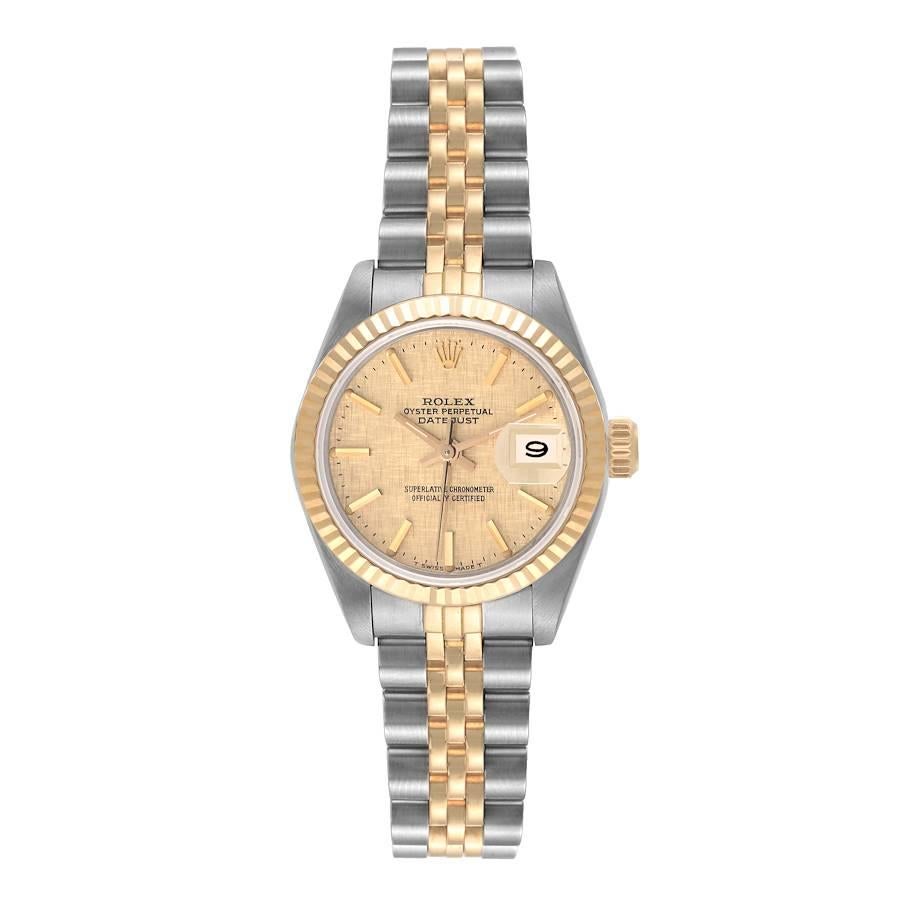 Rolex Datejust Steel Yellow Gold Champagne Linen Dial Ladies Watch 69173 Papers. Officially certified chronometer automatic self-winding movement. Stainless steel oyster case 26.0 mm in diameter. Rolex logo on the crown. 18k yellow gold fluted