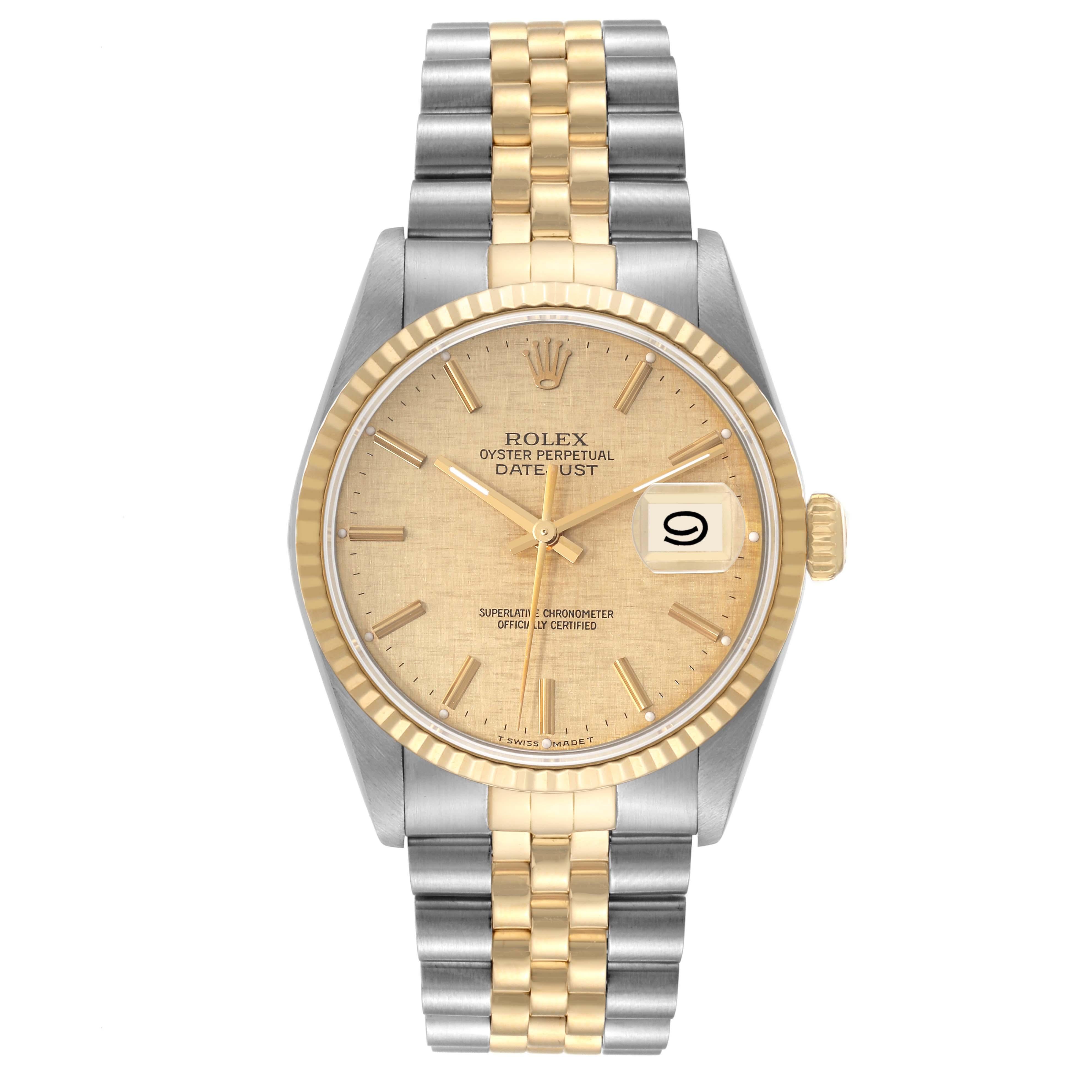 Rolex Datejust Steel Yellow Gold Champagne Linen Dial Mens Watch 16233. Officially certified chronometer automatic self-winding movement. Stainless steel case 36 mm in diameter.  Rolex logo on an 18K yellow gold crown. 18k yellow gold fluted bezel.