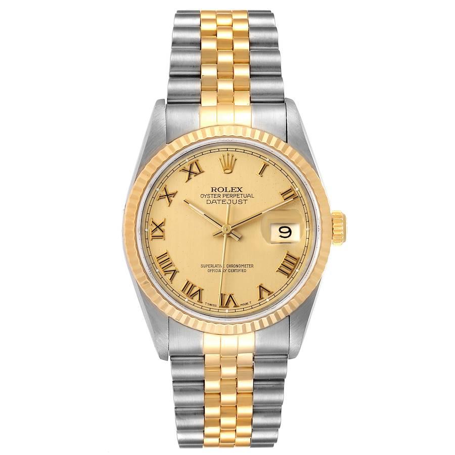Rolex Datejust Steel Yellow Gold Champagne Roman Dial Mens Watch 16233 Box. Officially certified chronometer self-winding movement. Stainless steel case 36 mm in diameter.  Rolex logo on a 18K yellow gold crown. 18k yellow gold fluted bezel. Scratch