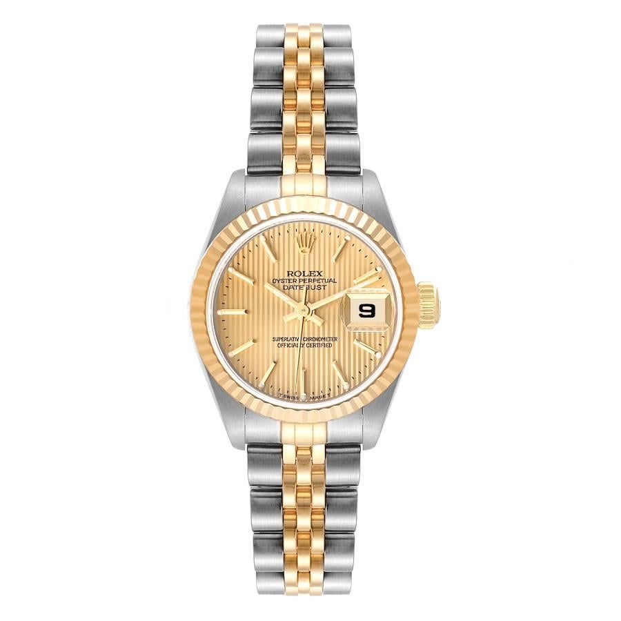 Rolex Datejust Steel Yellow Gold Champagne Tapestry Dial Ladies Watch 79173. Officially certified chronometer self-winding movement. Stainless steel oyster case 26 mm in diameter. Rolex logo on an 18K yellow gold crown. 18k yellow gold fluted bezel.