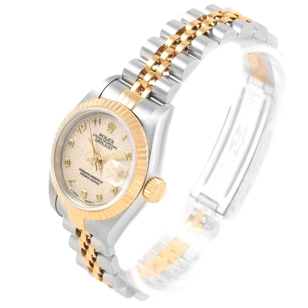 Rolex Datejust Steel Yellow Gold Ivory Jubilee Dial Ladies Watch 69173. Officially certified chronometer automatic self-winding movement. Stainless steel oyster case 26.0 mm in diameter. Rolex logo on a crown. 18k yellow gold fluted bezel. Scratch
