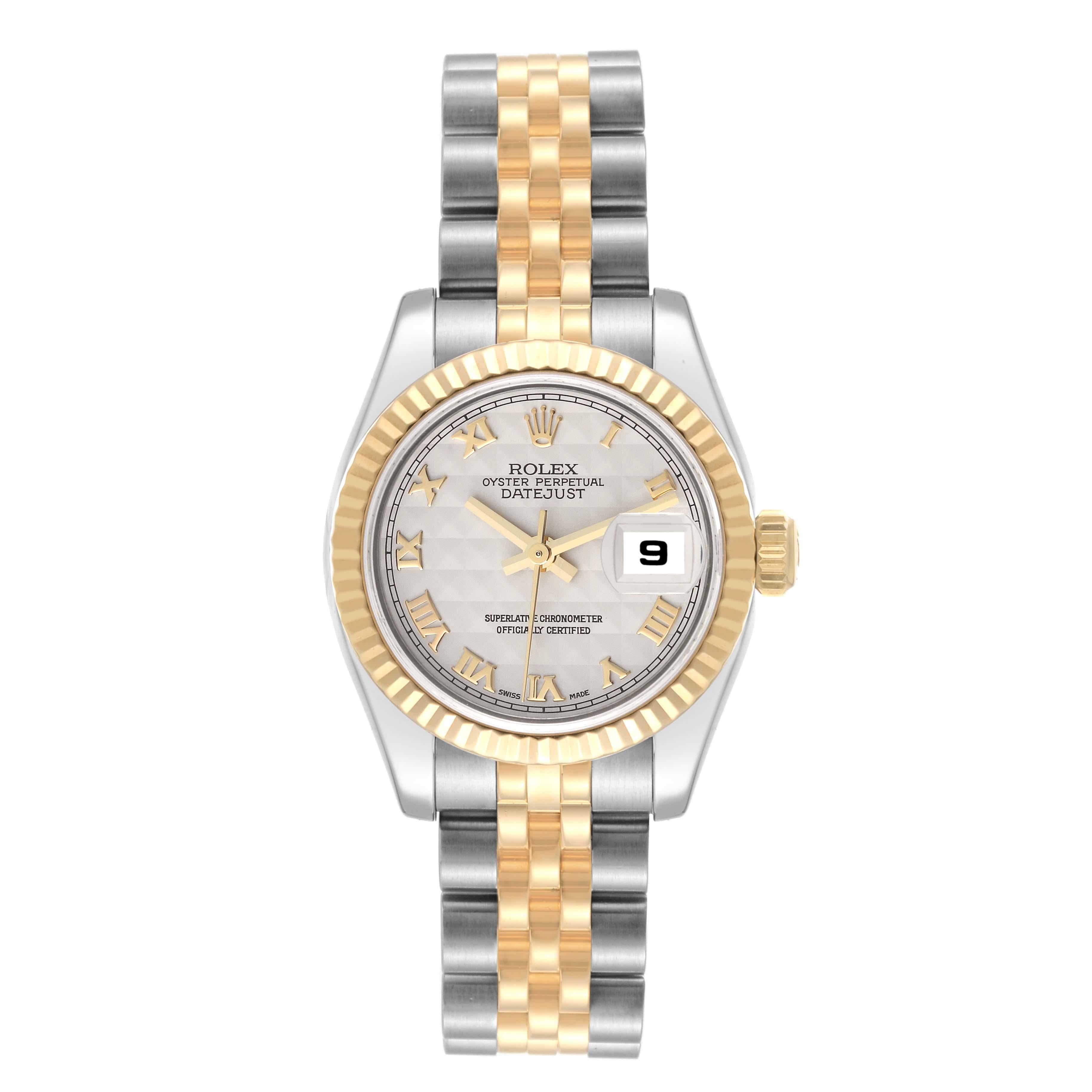 Rolex Datejust Steel Yellow Gold Ivory Pyramid Dial Ladies Watch 179173. Officially certified chronometer self-winding movement. Stainless steel oyster case 26 mm in diameter. Rolex logo on an 18K yellow gold crown. 18k yellow gold fluted bezel.
