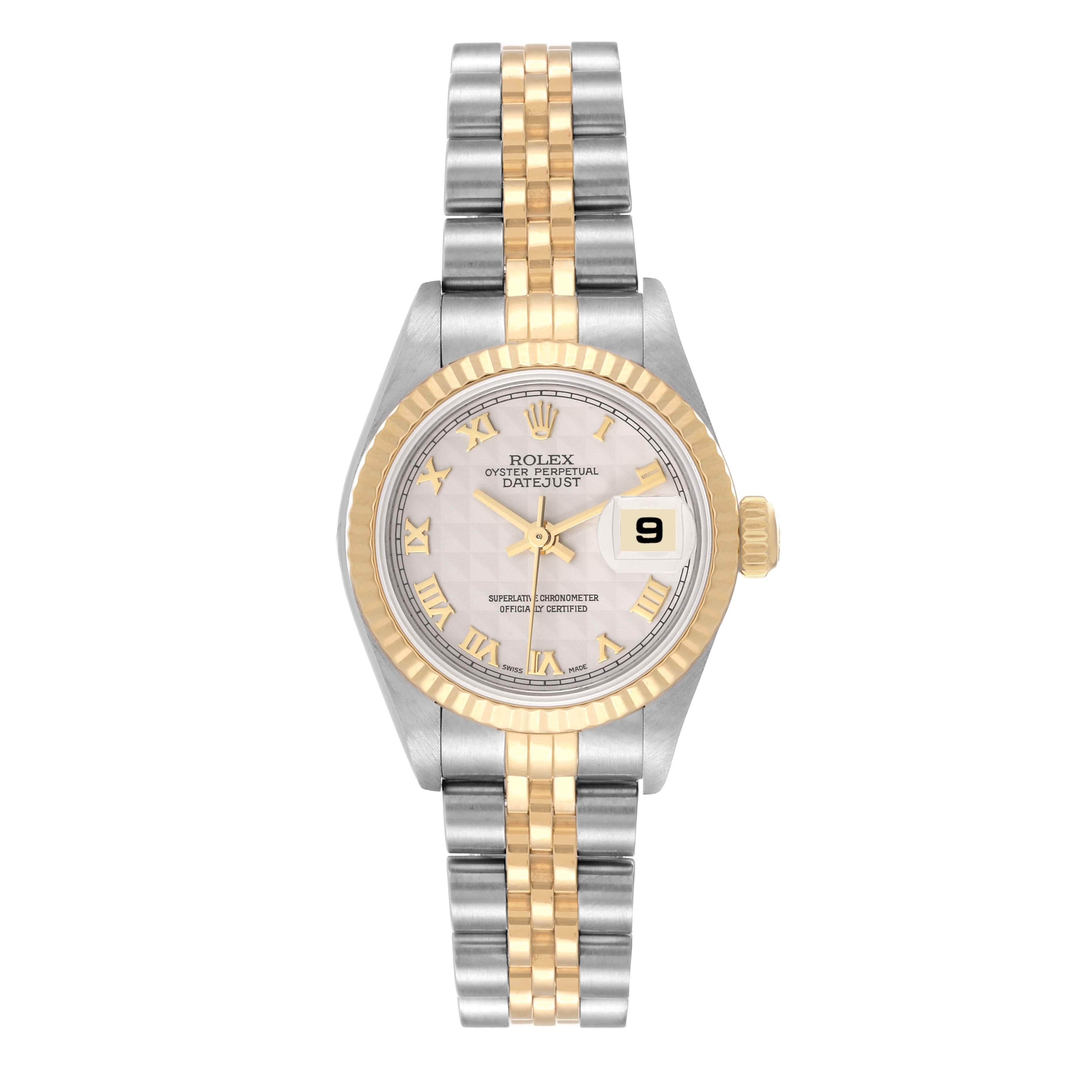 Rolex Datejust Steel Yellow Gold Ivory Pyramid Dial Ladies Watch 79173. Officially certified chronometer automatic self-winding movement. Stainless steel oyster case 26 mm in diameter. Rolex logo on an 18K yellow gold crown. 18k yellow gold fluted
