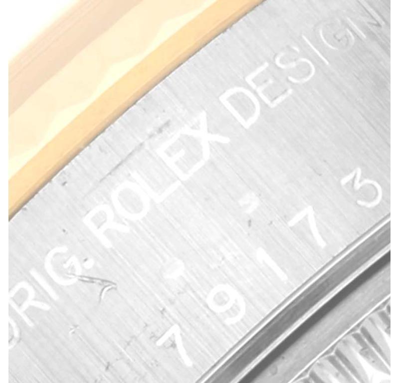 Montre Rolex Datejust en acier, or jaune, cadran pyramidal ivoire pour femmes 79173. Mouvement automatique à remontage automatique, officiellement certifié chronomètre. Boîtier oyster en acier inoxydable de 26 mm de diamètre. Logo Rolex sur une