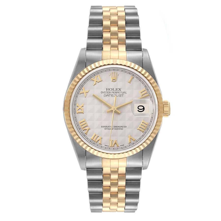Rolex Datejust Steel Yellow Gold Ivory Pyramid Dial Mens Watch 16233. Officially certified chronometer automatic self-winding movement. Stainless steel case 36 mm in diameter.  Rolex logo on an 18K yellow gold crown. 18k yellow gold fluted bezel.