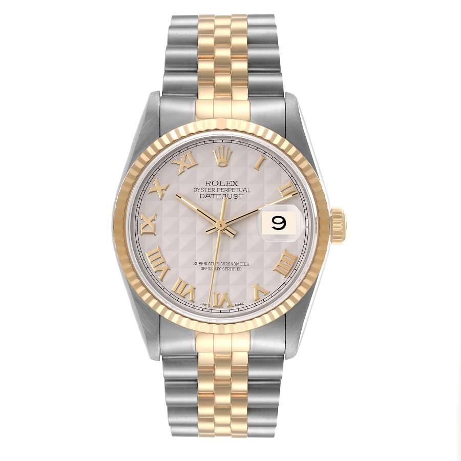 Rolex Datejust Steel Yellow Gold Ivory Pyramid Dial Mens Watch 16233. Officially certified chronometer automatic self-winding movement. Stainless steel case 36 mm in diameter.  Rolex logo on an 18K yellow gold crown. 18k yellow gold fluted bezel.