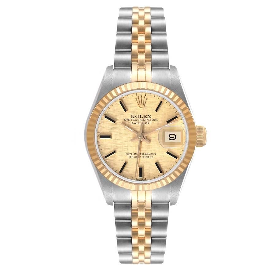 Rolex Datejust Steel Yellow Gold Linen Dial Fluted Bezel Ladies Watch 69173. Officially certified chronometer self-winding movement. Stainless steel oyster case 26.0 mm in diameter. Rolex logo on a crown. 18k yellow gold fluted bezel. Scratch