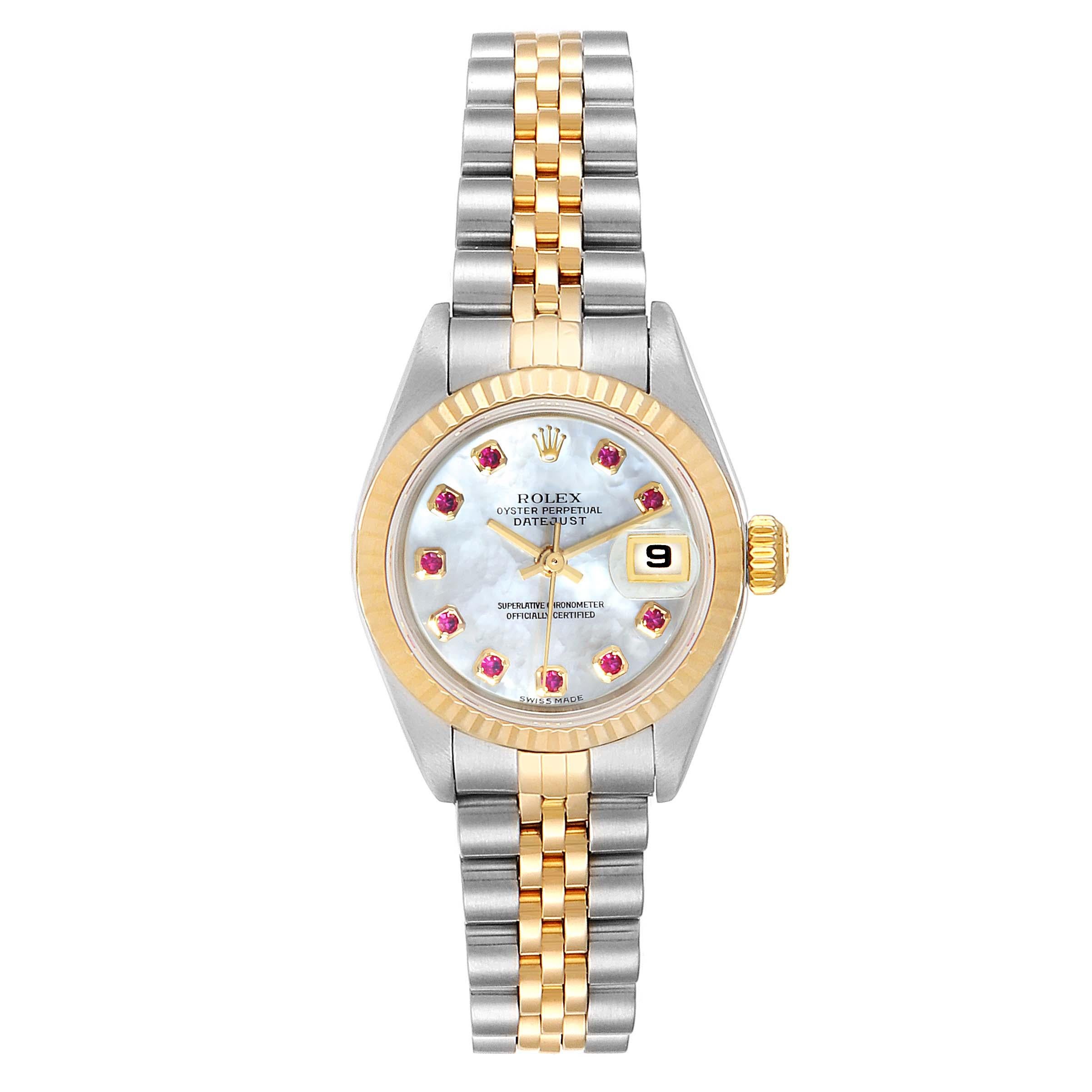 Rolex Datejust Steel Yellow Gold MOP Ruby Ladies Watch 79173 Box Papers. Officially certified chronometer self-winding movement. Stainless steel oyster case 26.0 mm in diameter. Rolex logo on a crown. 18k yellow gold fluted bezel. Scratch resistant