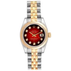 Montre Rolex Datejust en acier:: or jaune:: diamants rouges et vignettes pour femmes 179173