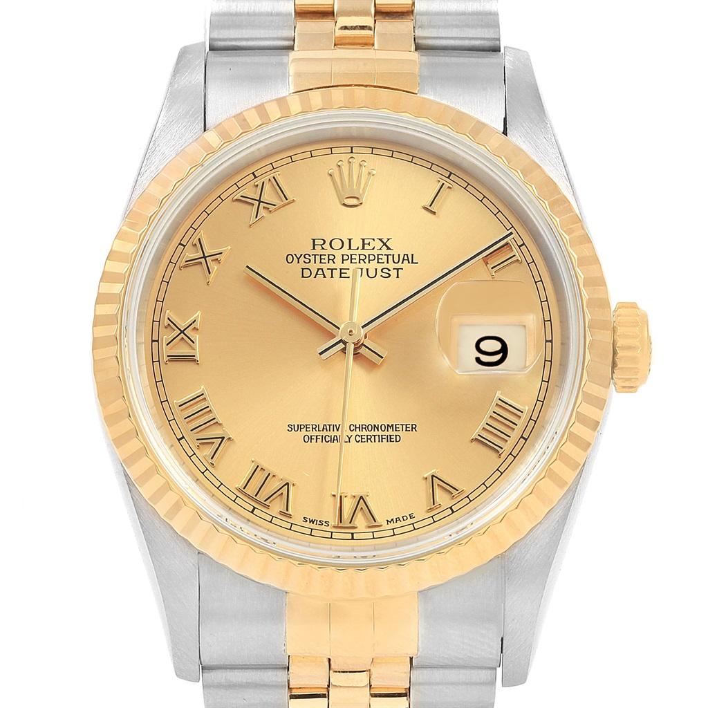Rolex Datejust Steel Yellow Gold Roman Dial Mens Watch 16233. Officially certified chronometer self-winding movement with quickset date function. Stainless steel case 36.0 mm in diameter. Rolex logo on a 18K yellow gold crown. 18k yellow gold fluted