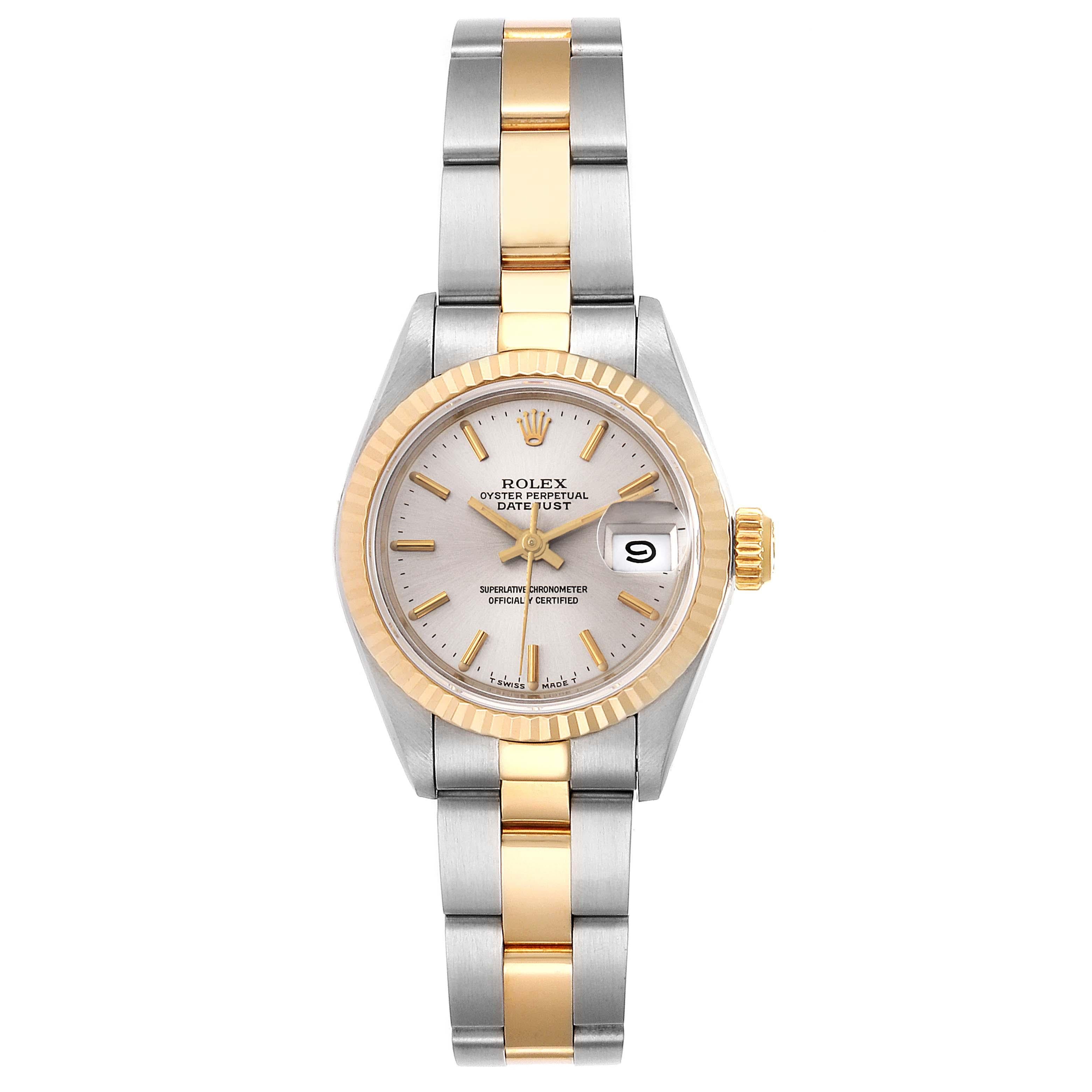 Rolex Datejust Steel Yellow Gold Silver Dial Ladies Watch 69173. Officially certified chronometer self-winding movement. Stainless steel oyster case 26 mm in diameter. Rolex logo on a crown. 18k yellow gold fluted bezel. Scratch resistant sapphire