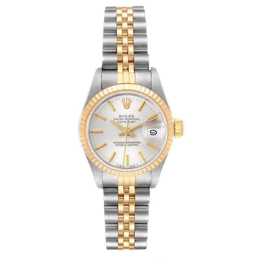 Rolex Datejust Steel Yellow Gold Silver Dial Ladies Watch 69173. Officially certified chronometer self-winding movement. Stainless steel oyster case 26.0 mm in diameter. Rolex logo on a crown. 18k yellow gold fluted bezel. Scratch resistant sapphire